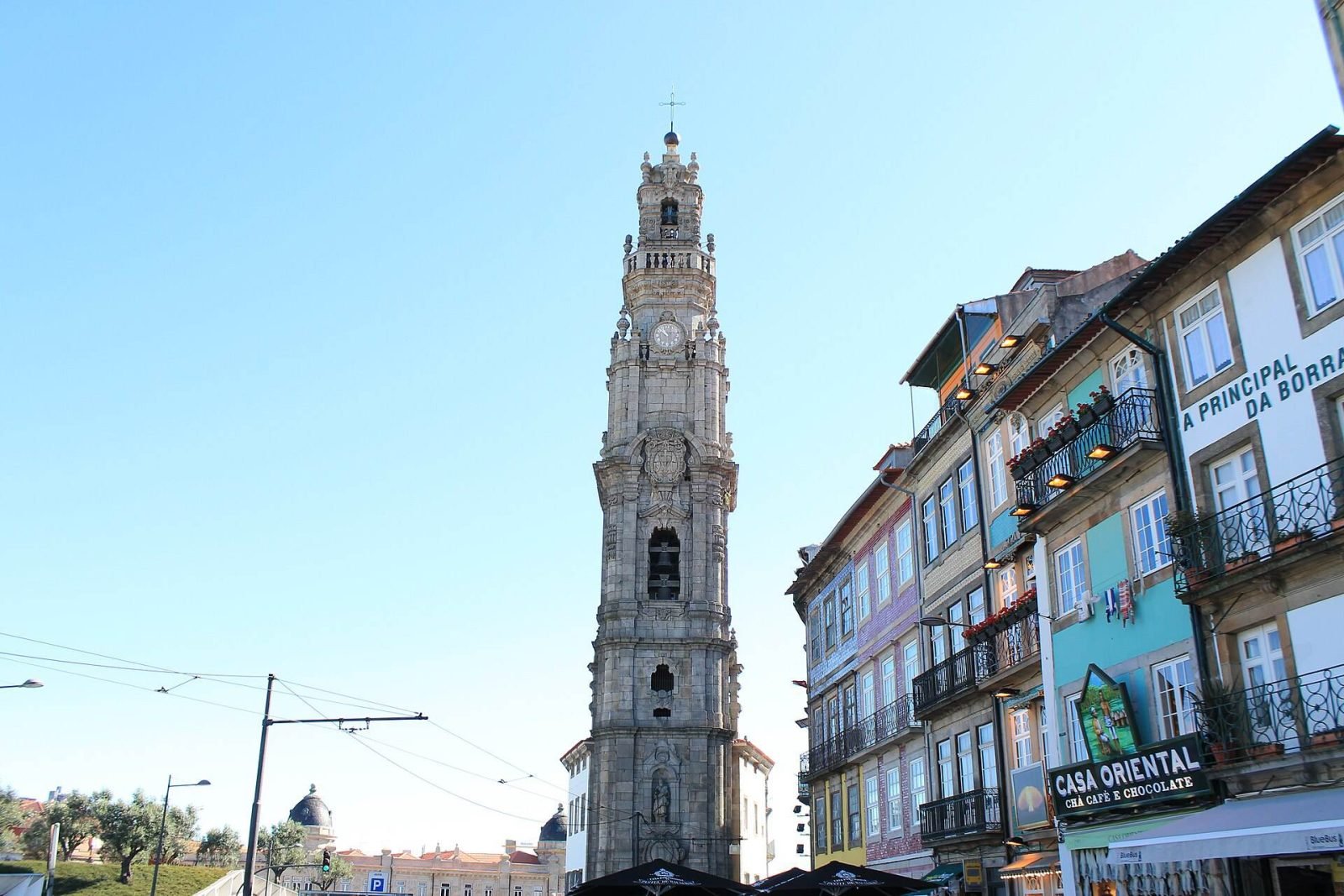 The baroque Clérigos Tower rising above a street of tiled buildings