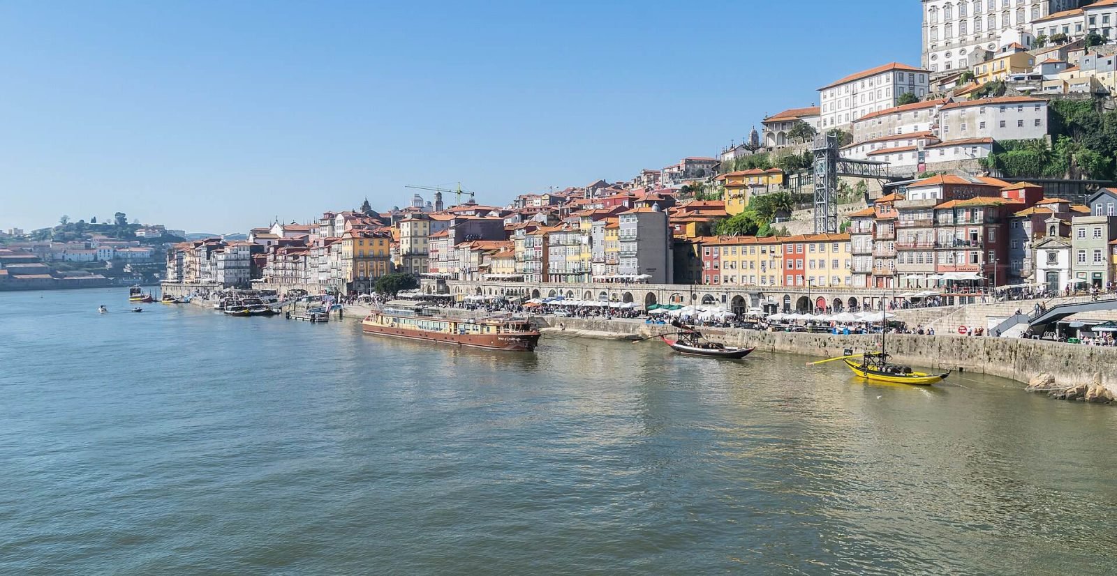 The colourful houses of Ribeira stacked above the Douro, seen from the Dom Luís I Bridge