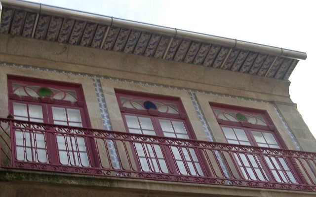 A quiet street of painted buildings in the Miguel Bombarda arts quarter